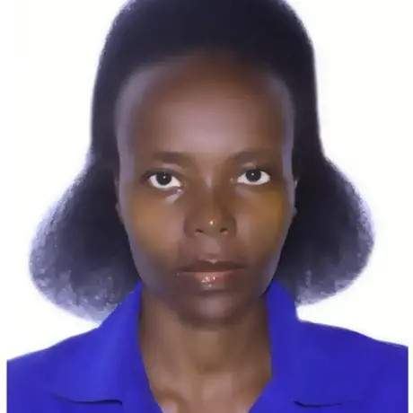 A woman with brown hair wears a purple shirt.