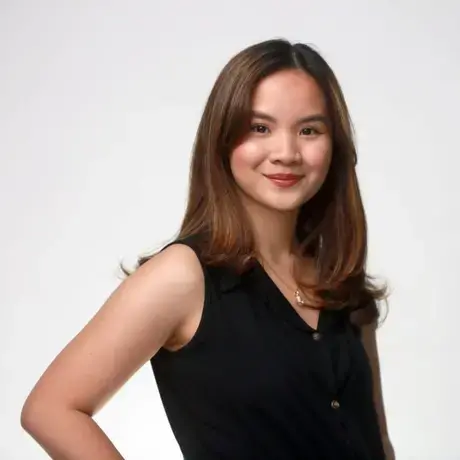 Headshot of a woman wearing black with long brown hair