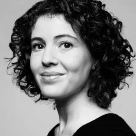 Black and white photo of a woman with curly dark hair