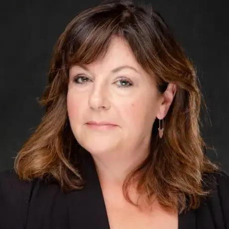 Headshot of a woman with shoulder-length brown hair