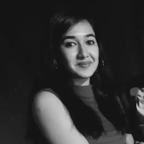 Black and white image of a woman with long dark hair