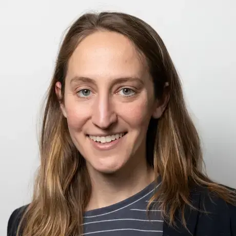 A woman with long light hair wearing a striped shirt