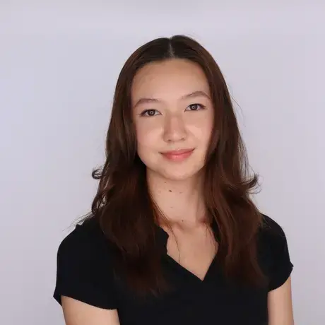 Headshot of Alexandra wearing a black t-shirt