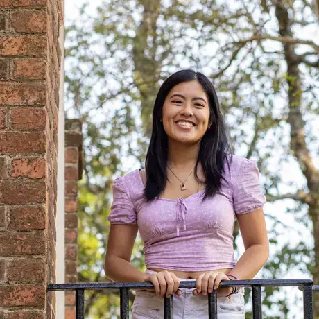 Headshot of Vivian outside wearing purple