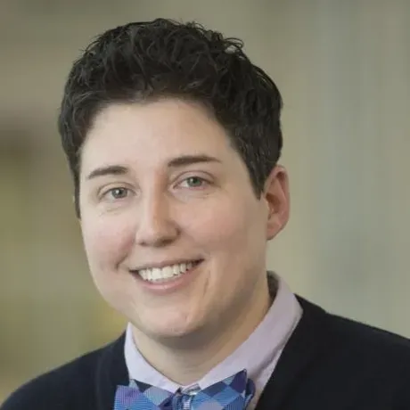 Headshot of person in suit with bowtie