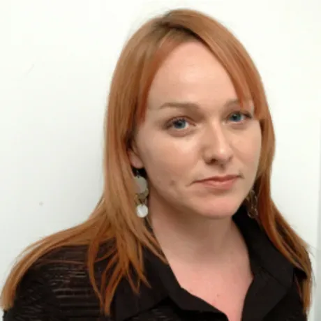 Headshot of woman with red hair