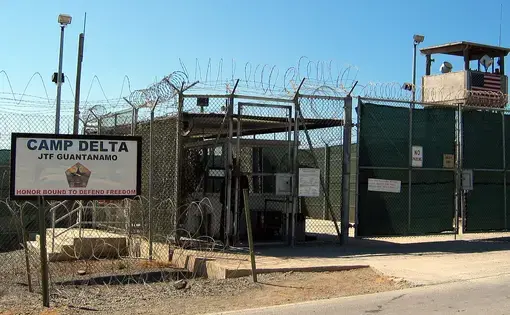 The entrance to Camp 1 in Guantanamo Bay's Camp Delta. The base's detention camps are numbered based on the order in which they were built, not their order of precedence or level of security. Photo by Kathleen T. Rhem. Cuba, 2018. Source: Wikimedia Commons.