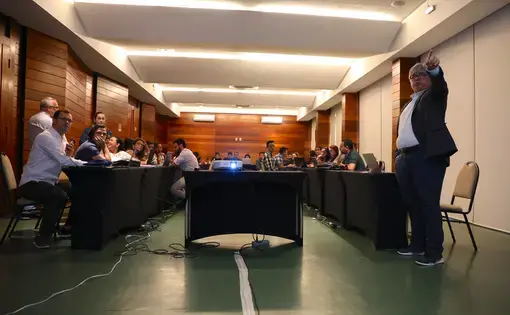 Dr. Claudio Salgado, president of the Brazilian Leprosy Society, points out a part of his presentation to his colleague Dr. Josafá Barreto during the second day of Leprosy Brainstorming. Image by Anton L. Delgado. Brazil, 2020.