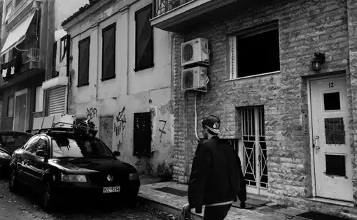 A young Iranian refugee revisits the shelter where he lived as an unaccompanied minor in Athens. It is managed by the Greek organization Nostos. Image by Divya Mishra. Greece, 2018.&nbsp;