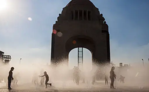 Children play in a public fountain near Mexico City's Monumento a la Revolucion. Image by Javier Garcia / Shutterstock. Mexico, undated.