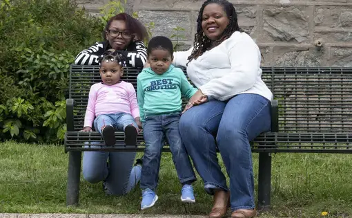 Kyana Hopkins-Thomas, right, is photographed with her kids, Imani Thomas, 15; Imara Thomas, 1; and Keion Thomas, 2, near their home in Philadelphia. Kyana is teacher who is juggling her students' needs with her own children. Image by Jose F. Moreno. United States, 2020.