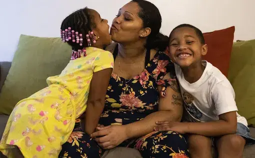 Tyra Johnson, who is 31 weeks pregnant, with her children Madison Hundley (left), 4, and Meegale Hundley, 5. Image by Colter Peterson / Post-Dispatch. United States, 2020.