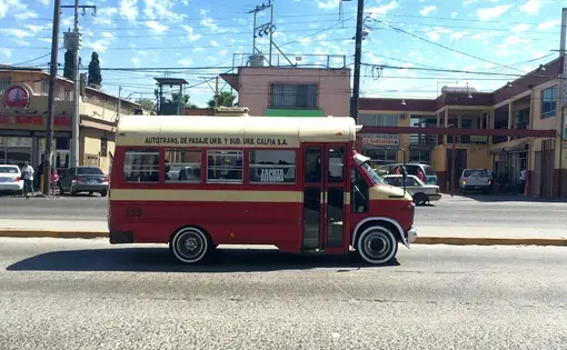This minibus, probably a secondhand American school bus, is owned by transportation firm Calfia. Note that vehicles like these, regardless of owner, are locally known as "calafias." Image by Patrick Reilly. Mexico, 2017.