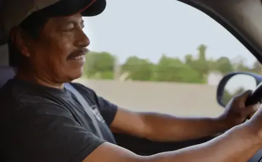 Winny Contreras drives to the farm he lives and works on while reminiscing about his son's message on Father's day. Image by Sana Malik. United States, 2019.