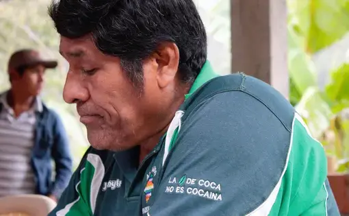 Don Mario, a coca producer in Yungas, Bolivia, has a t-shirt that reads “coca no es cocaína," (coca isn't cocaine). Image by Alice Campaignolle. Bolivia, undated.