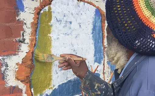 Jamaica Ray at work on Old North building. Image by Sylvester Brown / The St. Louis American. United States, 2020.