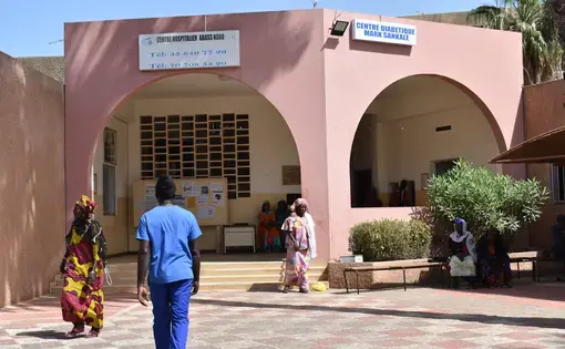 Citizens walking outside of local hospital. Sengal, 2019.