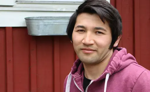 Abdullah, 18, shown here in front of an asylum center in Kungälv. Image by Amy Russo. Sweden, 2017.