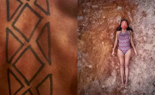 Tupi laying down on the beach in her community. Image by Pablo Albarenga. Brazil, 2019.