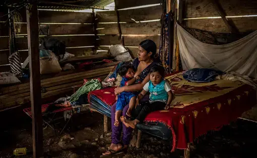 ALTA VERAPAZ. Jorge A.’s wife, Eva María H., at home with two of their children. Image by Meridith Kohut. Guatemala, 2020.