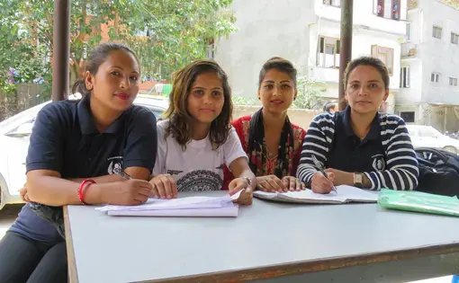 Survivors and certified paralegals Renuka, Bidhya, Apsara, and Santa work in a Kathmandu police station filing criminal complaints. Image by Nicole Brigstock. Nepal, 2018.&nbsp;