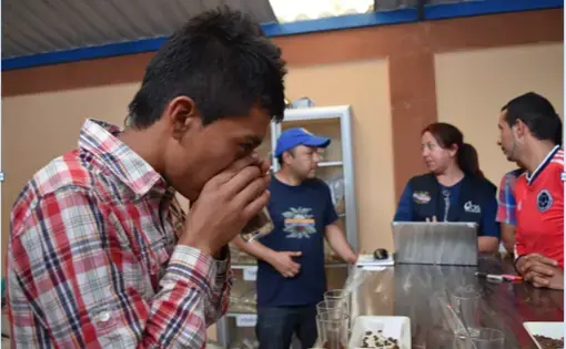 "Meet the future generation of coffee " In CRS coffee labs, university students are being trained in the production of coffee. When I asked this young man if this was something they wanted to do all their life. He responded “of course.” For him coffee is more than a job, it is a way to help their communities grow and have a better life. Image by Camila DeChalus. Colombia, 2016.