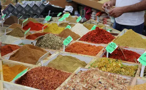 A spice shop in the Muslim Quarter of Jerusalem's Old City. Za'atar, an herb mix ubiquitous in the region's cuisine, once grew wild all over what's now in the West Bank. A 1977 Israeli law criminalized the harvesting of the herb. Israelis say it protects an endangered plant species. Palestinians say it's another way to erase their identity and limit their ability to cook their traditional dishes. Image by Carly Graf. West Bank, 2019.