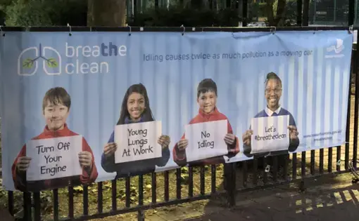 Campaigns such as "Breathe Clean" in the U.K. emphasize the threat that air pollution poses to children. This poster, taped to the gate of a park, aims to bring awareness to both children and parents. Image by Rohan Naik.&nbsp;United Kingdom, 2018.