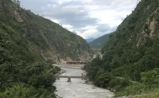 The Punatsangchhu River is the hotspot for hydropower construction in Bhutan: Pictured is the new mega Punatsangchhu-II hydroelectric project, delayed extensively by geologic challenges. Image by Emma Johnson. Bhutan, 2019.