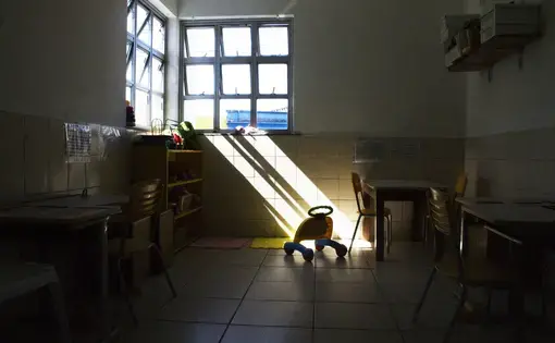 In a vacant children's room, toys and tools are stored in their assigned places. Image by Amanda Michelle Gordon. Brazil, 2018.
