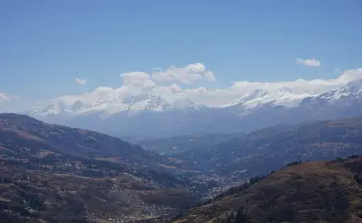 Huaraz below the snow-covered peaks of the Cordillera Blanca, the second tallest mountain range after the Himalayas. Image by Audrey Fromson. Peru, 2019.