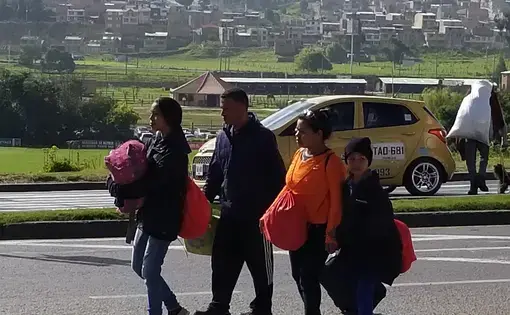 A family of caminantes walk through Tunja. Image by Patrick Ammerman. Colombia, 2019.