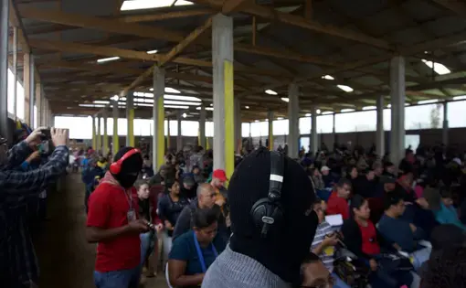 At the final meeting of a three-day-long “encuentro,” or political gathering, in the village of Morelia—deep in the Zapatista autonomous zones—participants filled a pavilion to listen to speeches summarizing the results of the previous day’s debates. Here, a Zapatista activist records the speech of Subcomandante Galeano, the de facto spokesman for the Zapatistas. Image by Jared Olson. Mexico, 2018.