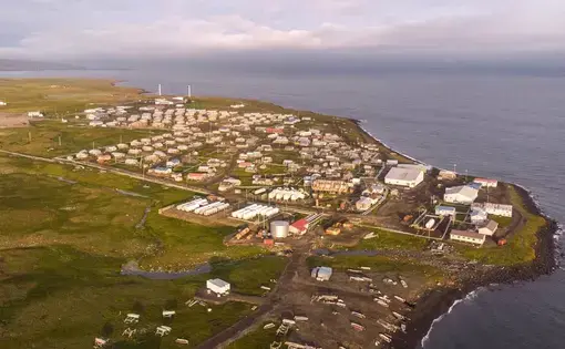 The village of Savoonga, with a population of about 700, spreads along the shores of St. Lawrence Island in the northern Bering Sea, giving residents a ringside seat to the effects of climate change. Most residents are Siberian Yup’ik, a Native people who also live along the northeast Russia coast. Image by Steve Ringman. United States, 2019.