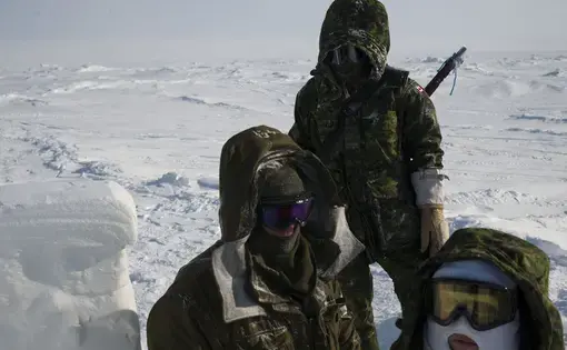 Canadian soldiers on the ice Sheet near Little Cornwallis Island during a military operation in -57 C weather in Nunavut Canada. Image by Louie Palu. Canada, 2017.