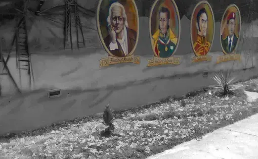 Art propaganda of some of the Venezuelan historical figures outside&nbsp;the walls of the national electric company,&nbsp;CORPOELEC.&nbsp;(From left to right: Francisco de Miranda, Antonio José de Sucre, Simón Bolívar and Hugo Chávez). Image by Lila Franco. Venezuela, 2017.