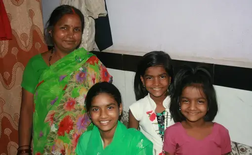 Rima Prajapati with daughters (from left) Jhoti, Aarti and Sangeeta. Jhoti and Aarti were both born deaf. Rima moved her daughters from their village to Mumbai so they could attend a school for the deaf. Image by Kate Petcosky-Kulkarni.&nbsp;India, 2016.
