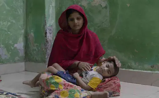 Azaan, 3, with his mother Nagma. Image by by Rohit Jain. India, 2020.