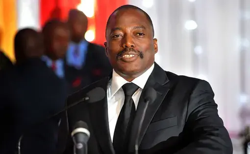Congolese President Joseph Kabila proposes a toast during a state banquet in honor of President Jacob Zuma at the African Union Village in Kinshasa. Image by GCIS, courtesy of GovernmentZA on Flickr.