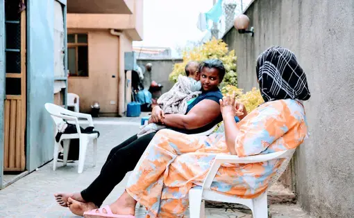 Women being cared for talk on the back patio of Agar. Image by Meklit Mersha. Ethiopia, 2019.