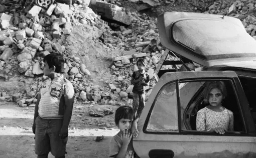 The Abdullah family fled Mosul during the battle, which was the most intense urban combat since the Second World War. They returned to find their home destroyed. Image by Moises Saman / Magnum for The New Yorker. Iraq, 2018.