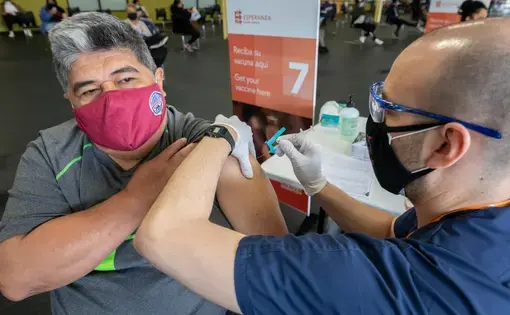 A man receiving a vaccination.