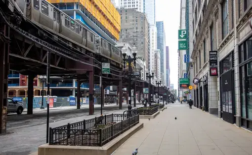 Nearly empty streets in downtown Chicago, near L train tracks.
