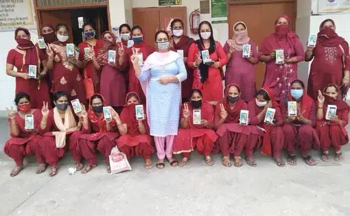 Group of workers pose together for a photo