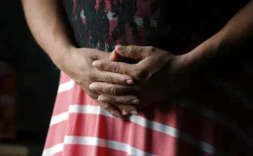Brisa's clasped hands