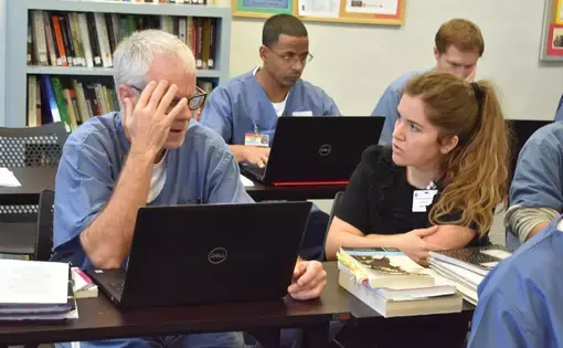 Classroom photo. Educator with incarcerated students.