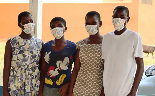 Teenagers in Ghana in masks