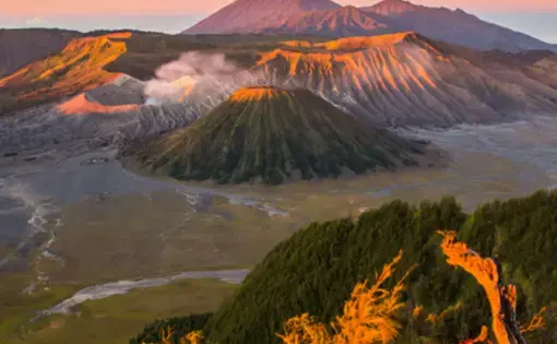 An aerial overview of a volcano and a national park.
