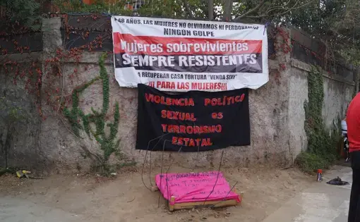 A sign reading “Sexual political violence is state terror.”