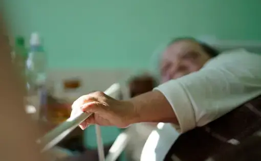 a woman's hand reaches out